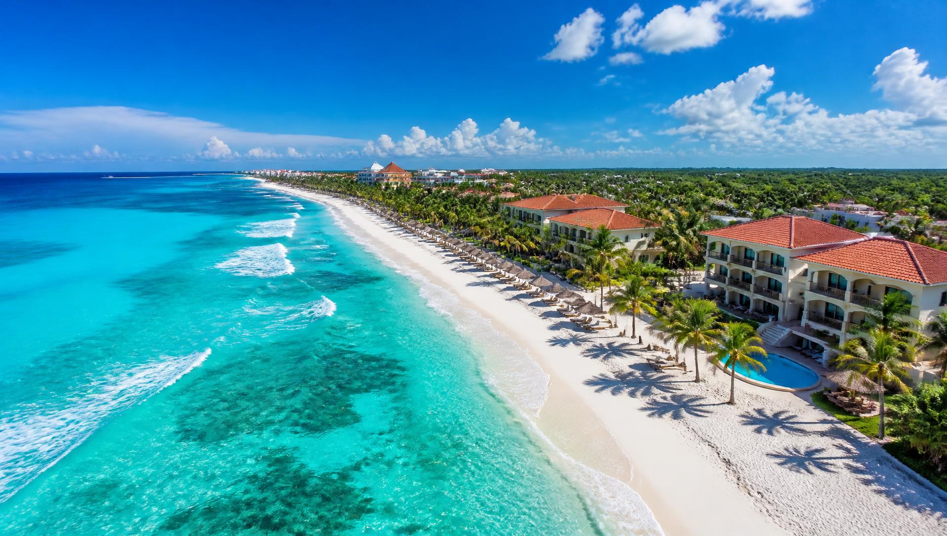 Aerial view of a pristine Cancun beach with turquoise water and white sand